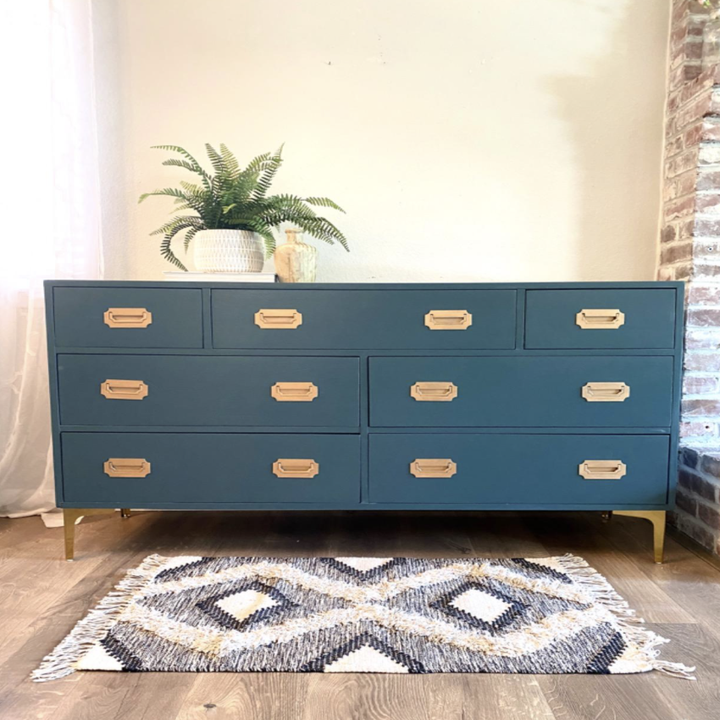 A dresser with the furniture feet