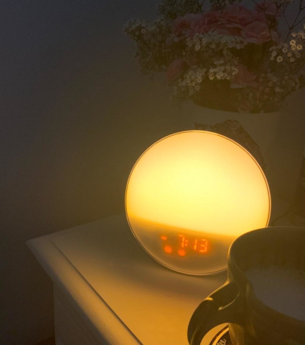reviewer photo showing sunrise alarm clock &quot;lit up&quot;