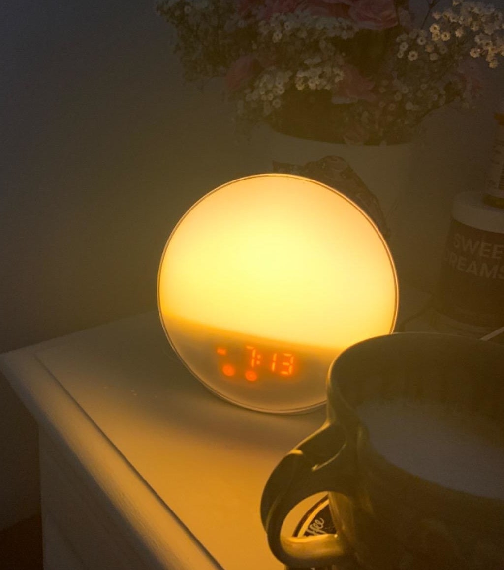 reviewer photo showing sunrise alarm clock &quot;lit up&quot;