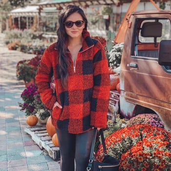 Reviewer wearing orange-red Zesica quarter-zip pullover