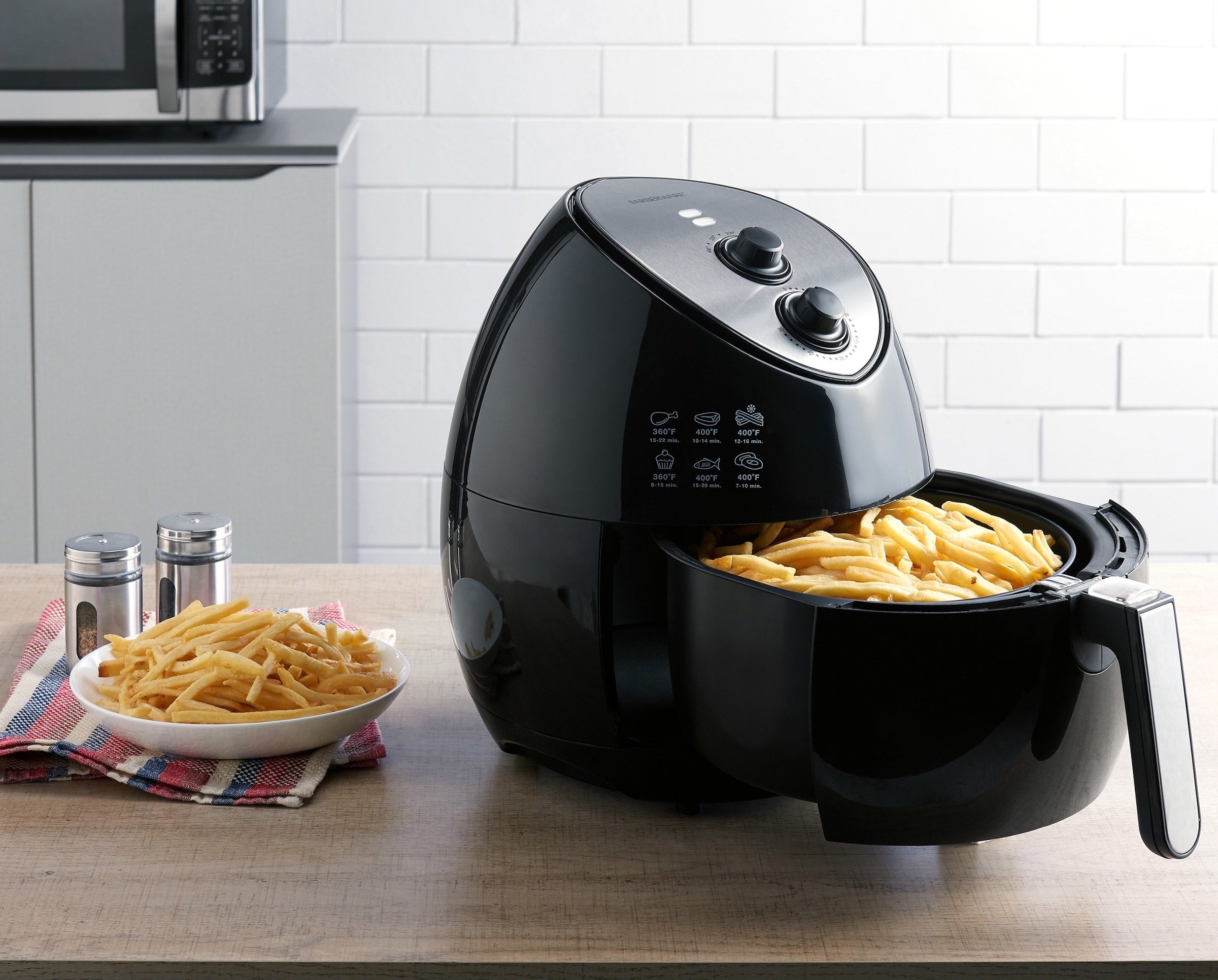 black farberware air fryer with fries in the fryer basket