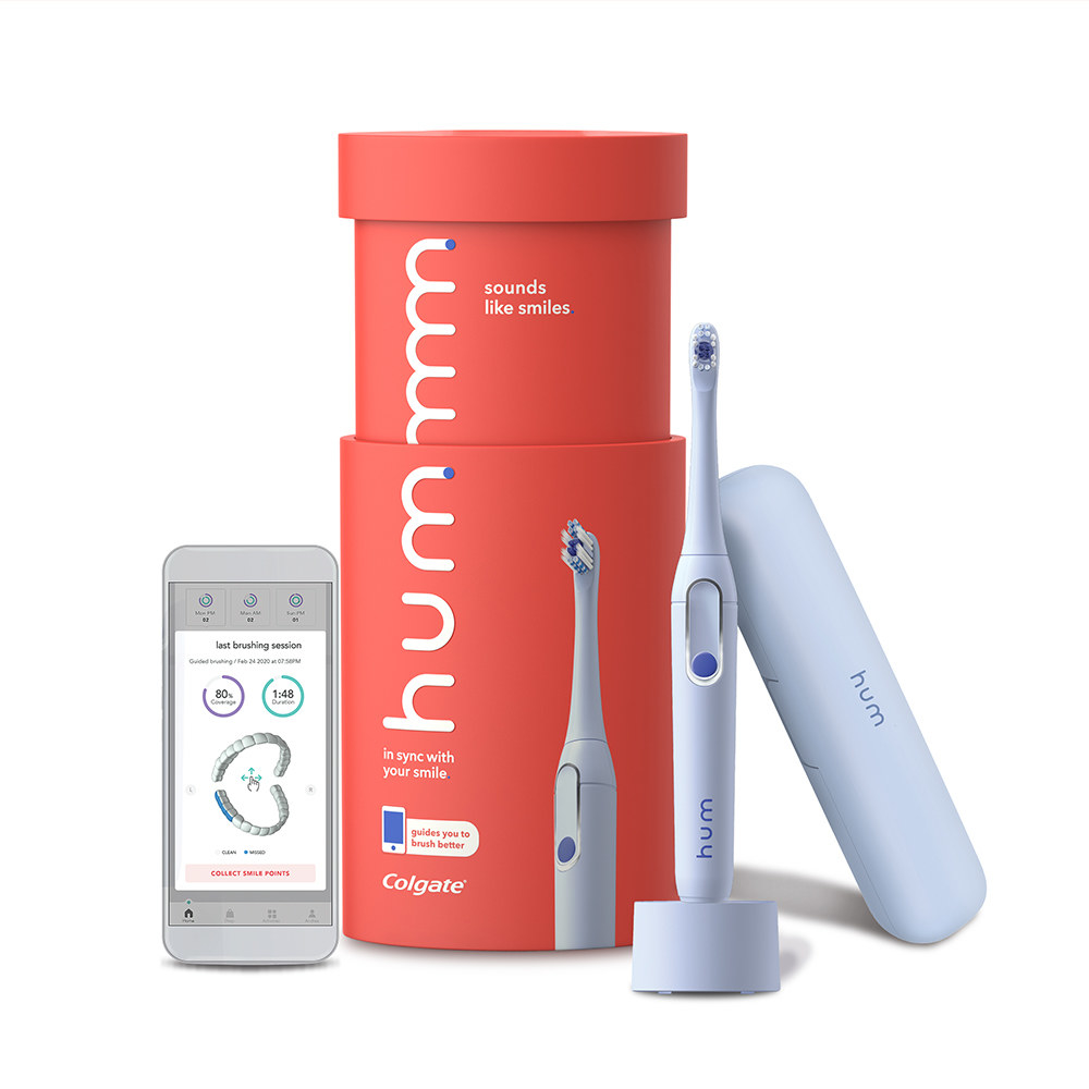 hum electric toothbrush by colgate including charger, toothbrush, and case