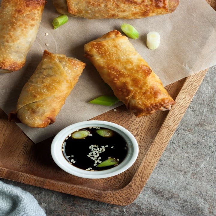 Air fried crispy egg rolls with soy dipping sauce.