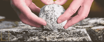 GIF of a geode opening to reveal the crystals inside