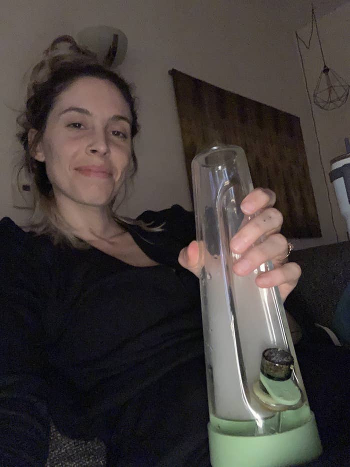 An image of the author holding the Session Goods water bong in the green color.