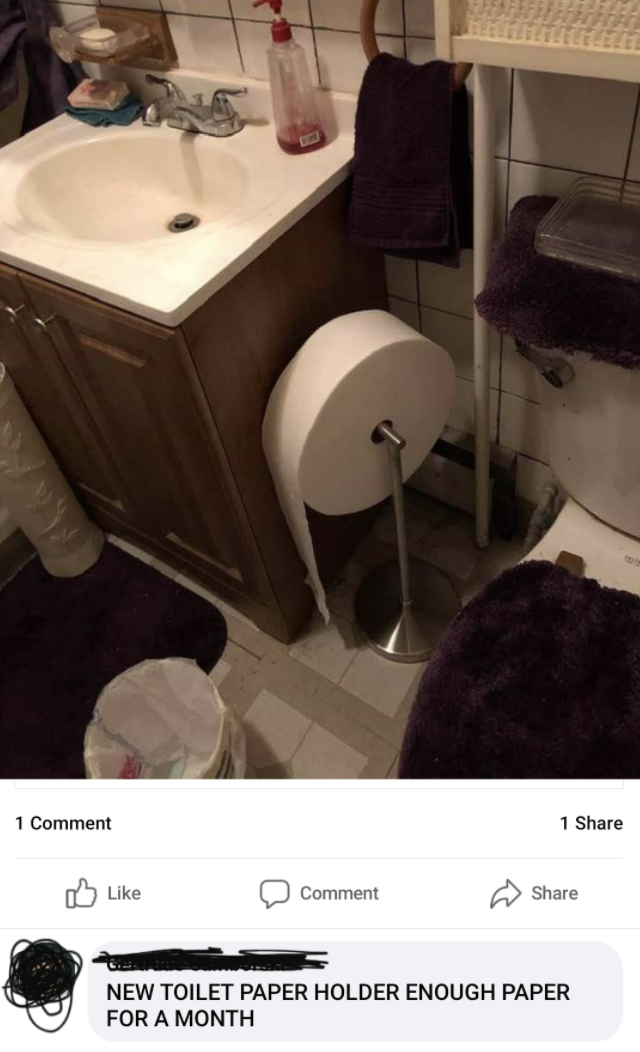 a picture of a large toilet paper roll with the comment new toilet paper holder enough paper for a month