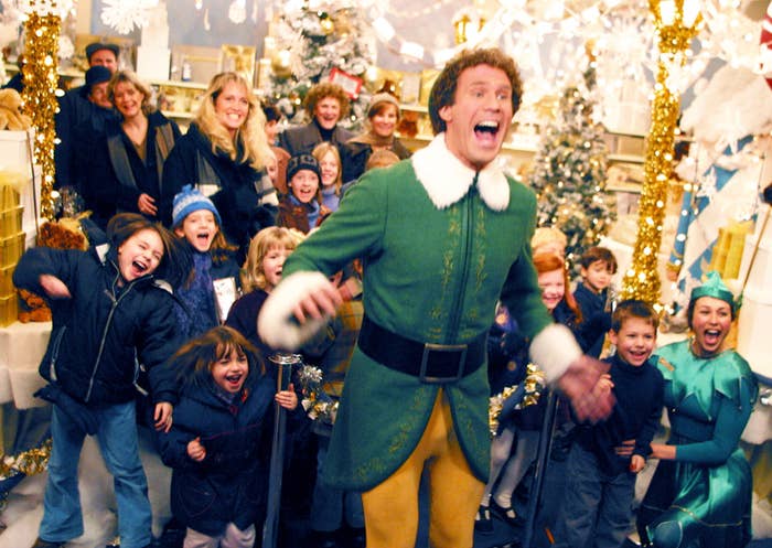 Will Ferrell as "Buddy the Elf" screaming for Santa Claus among kids