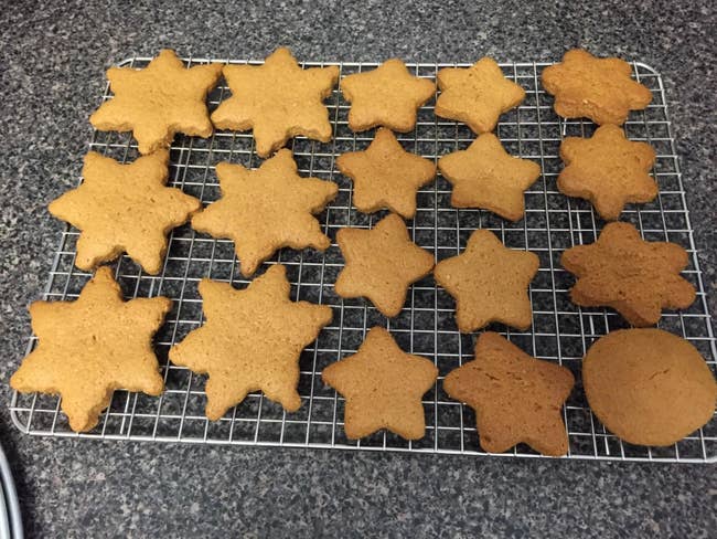 reviewer image of star-shaped and circular cookies on the spring chef cooling rack
