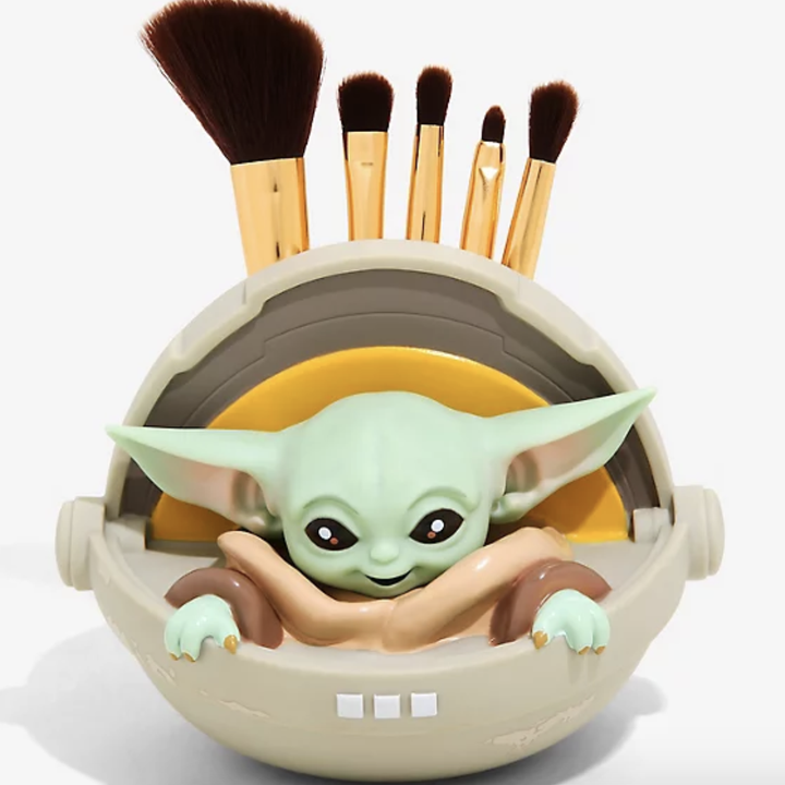 A Baby Yoda makeup brush holder 