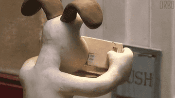 gif of gromit, the dog from &quot;wallace and gromit&quot; flipping through several mailed envelopes 