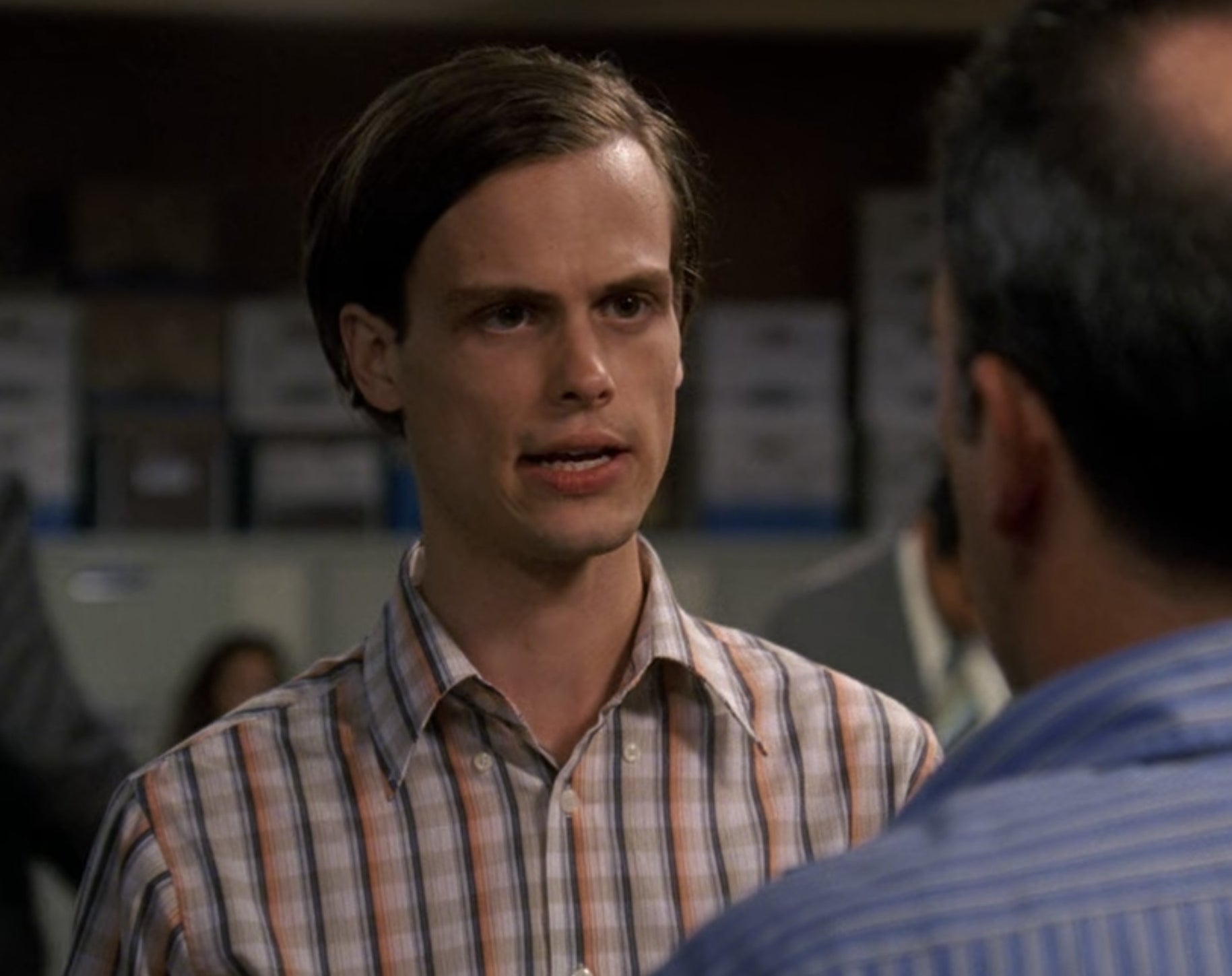 Spencer Reid from Criminal Minds talking to a person