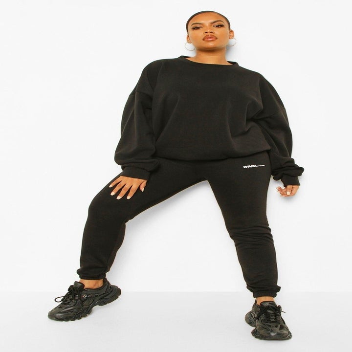 Model wearing black Boohoo fleece loopback sweatshirt