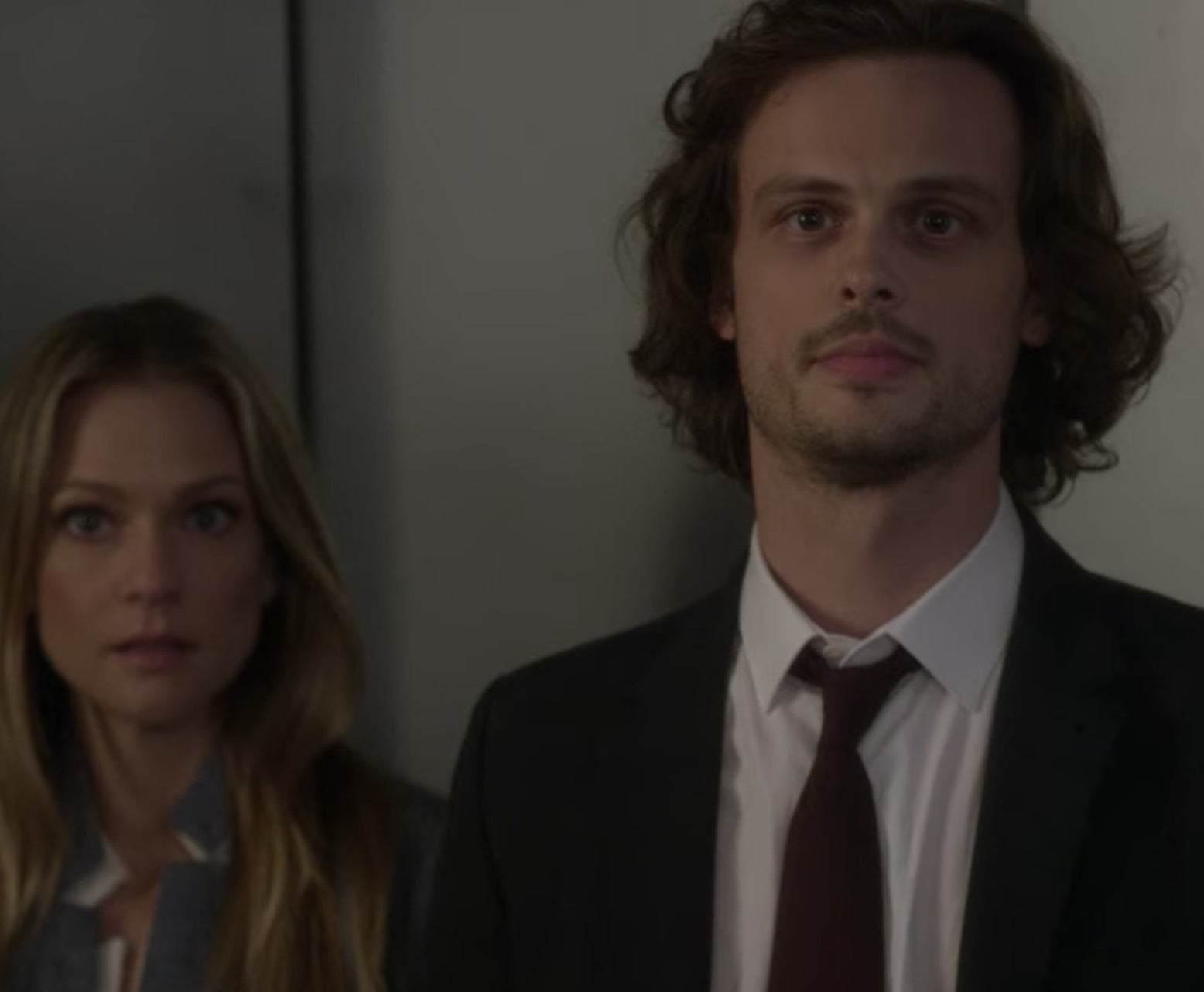 Spencer Reid from Criminal Minds standing next to a person