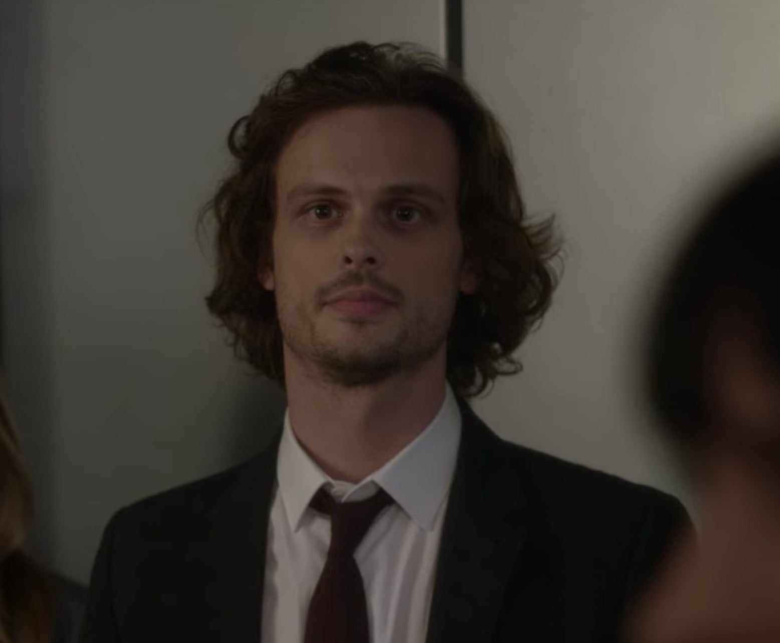 Spencer Reid from Criminal Minds standing next to a person