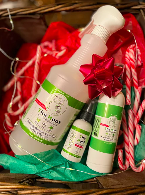 the all-purpose cleaner in a spray bottle, smaller cleaner bottle, and two-ounce air fresherner in a gift basket with candy canes 