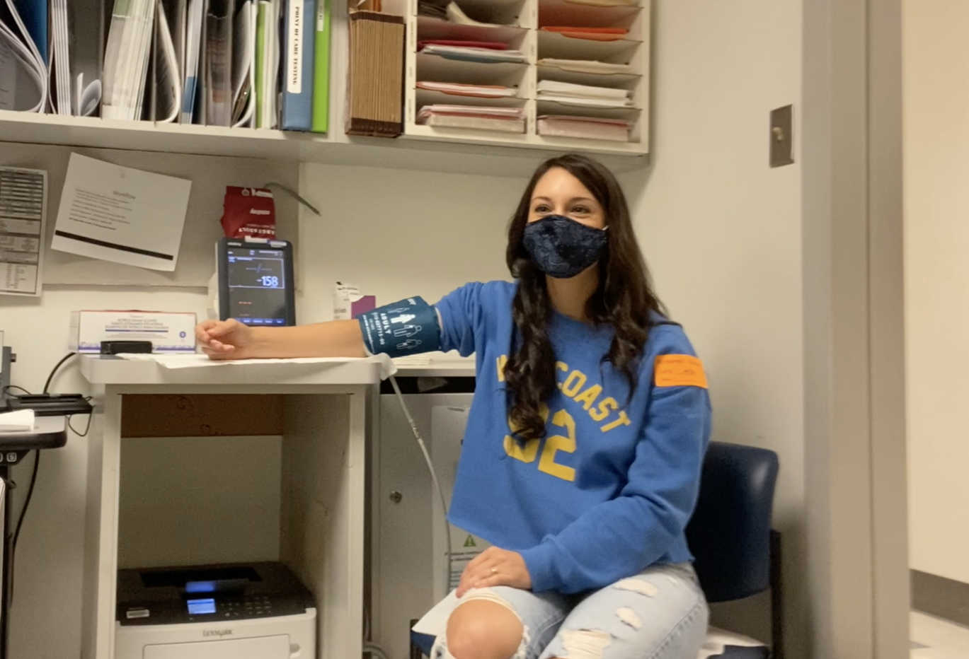 Image of Krista getting her blood pressure taken.