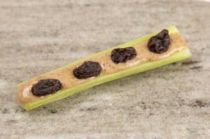 A picture of ants on a log. (The snack with celery, peanut butter, and raisins. Not real ants.)