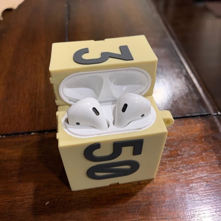 reviewer's case with airpods inside 