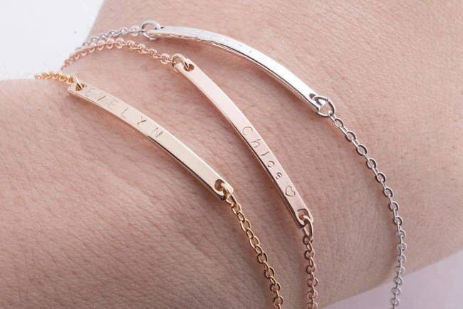 person wearing the three available bracelet finishes — silver, gold, and rose gold