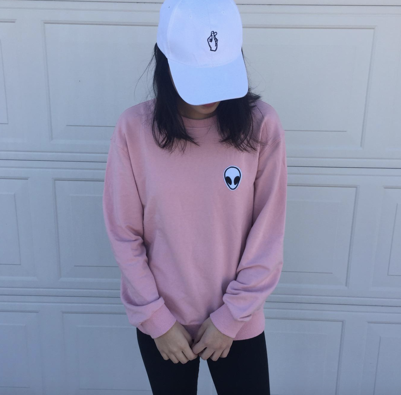 reviewer wearing the pink sweatshirt