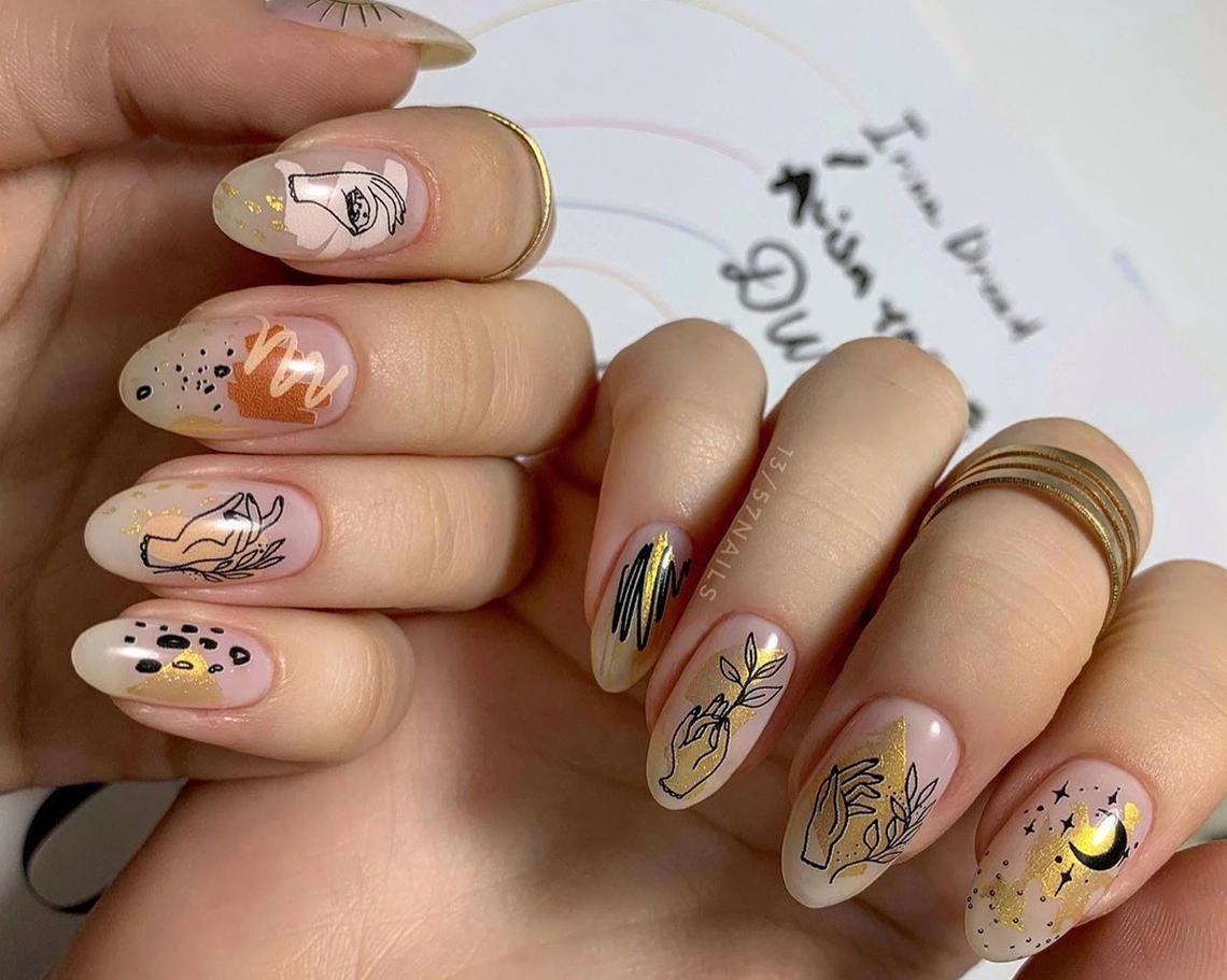 A person wearing the nail decals