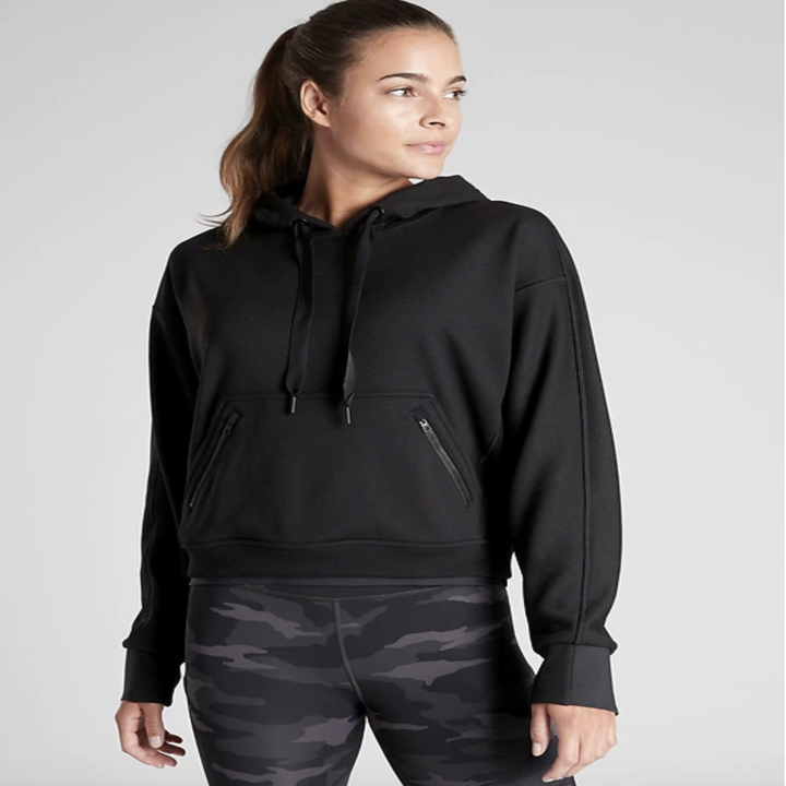 Model in black drawstring hoodie 