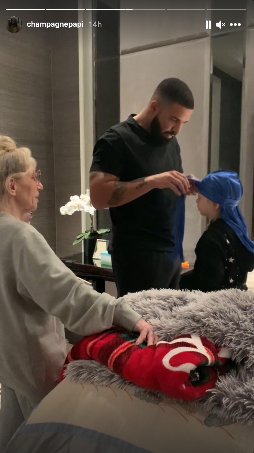 Drake continues to tie Adonis&#x27;s durag as Drake&#x27;s mom, Sandi Graham, watches nearby