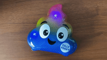A gif made by BuzzFeed Editor John Mihaly of the colorful light up toy that looks like the poop emoji