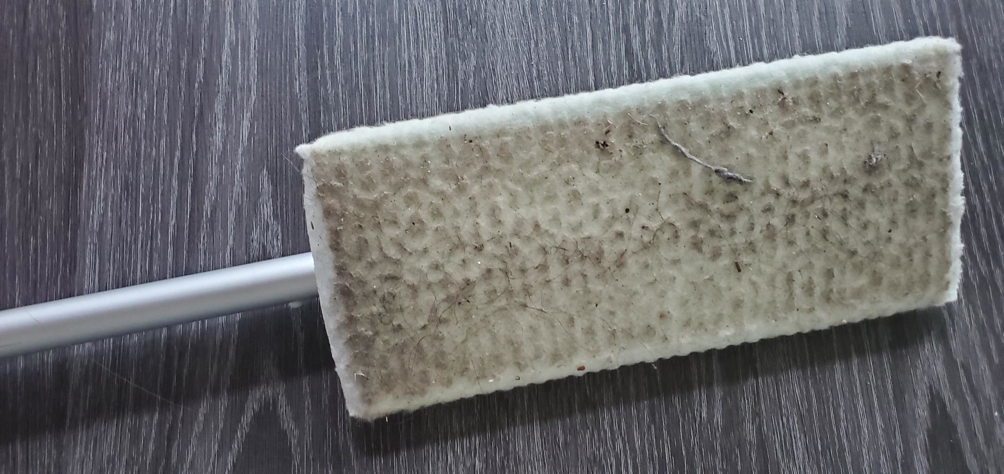 Reviewer&#x27;s photo of their Swiffer Sweeper after cleaning the floors