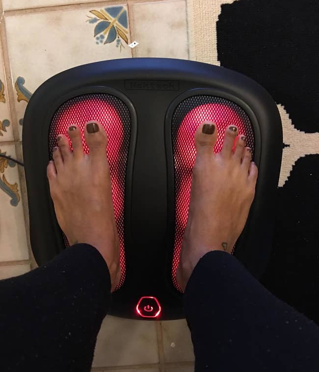 Reviewer feet on heated foot massager