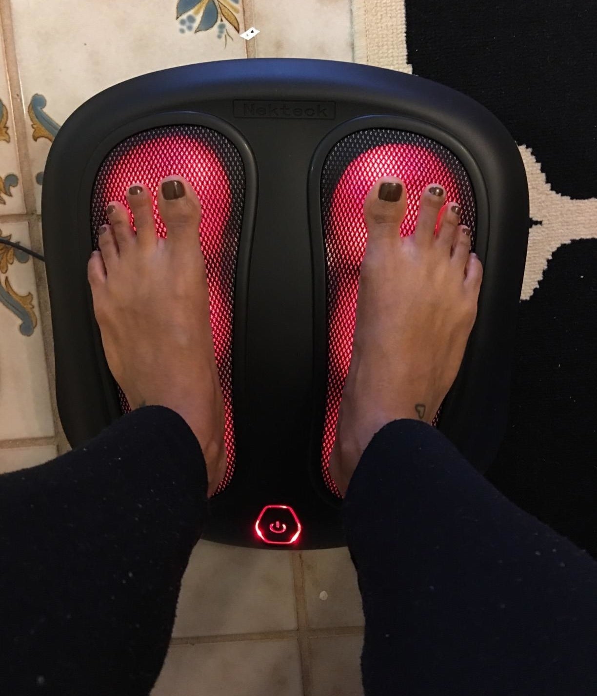 Reviewer feet on heated foot massager