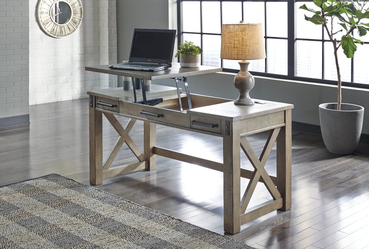 wooden desk with the lift-top up to create a standing desk