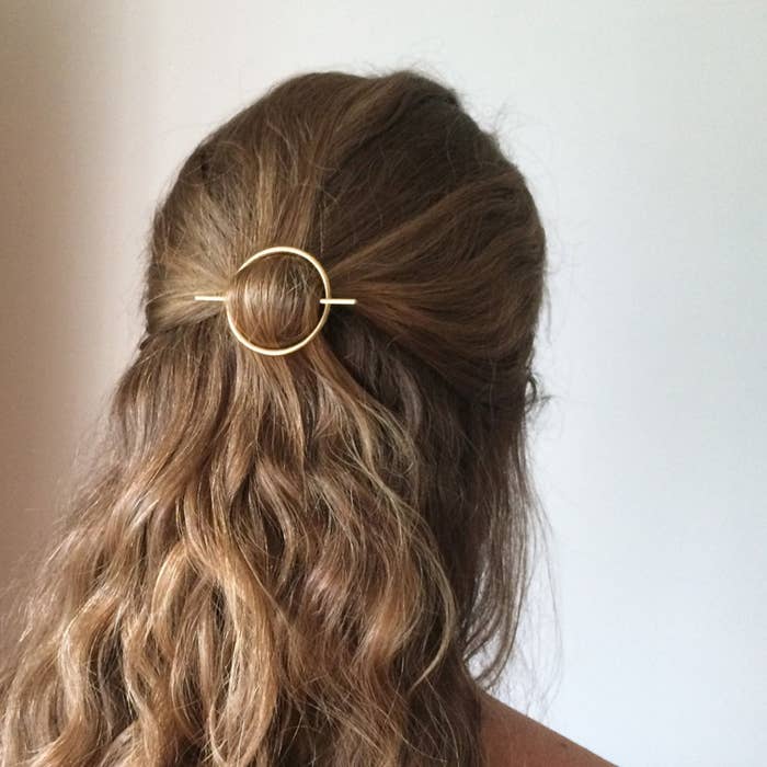 back of persons head with the round clip 