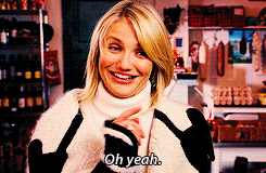 Cameron Diaz/Amanda smiles and says &quot;oh yeah&quot; before drinking from a bottle of wine