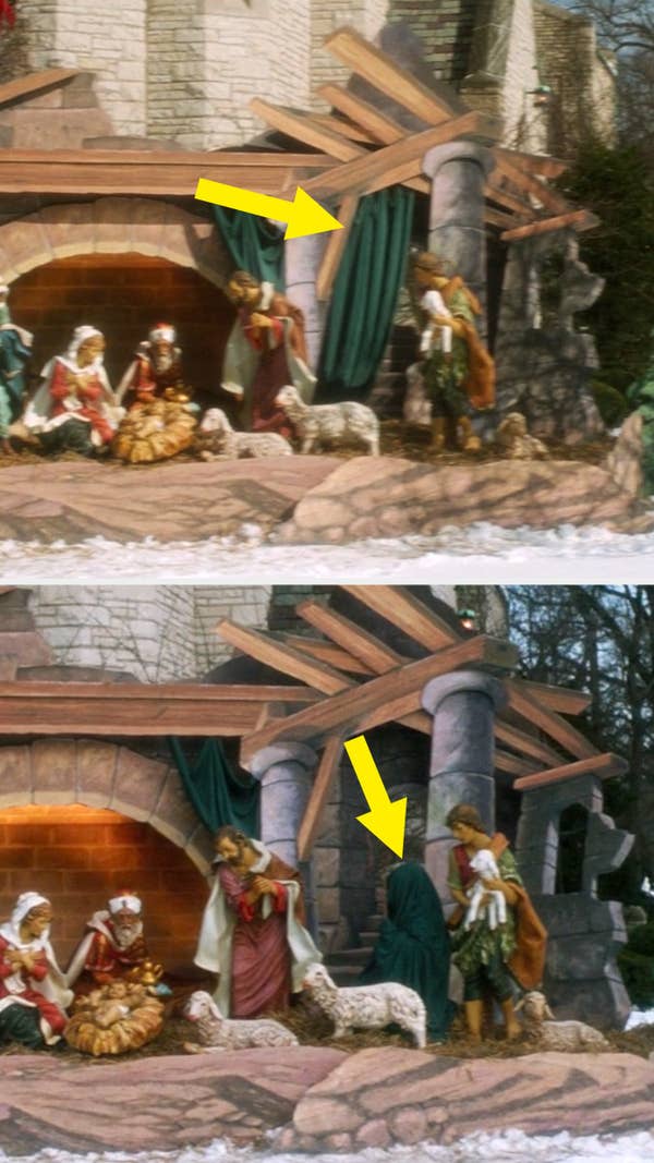 A green curtain hangs on a nativity display outside a church and in the next shot Kevin is using the robe to hide himself