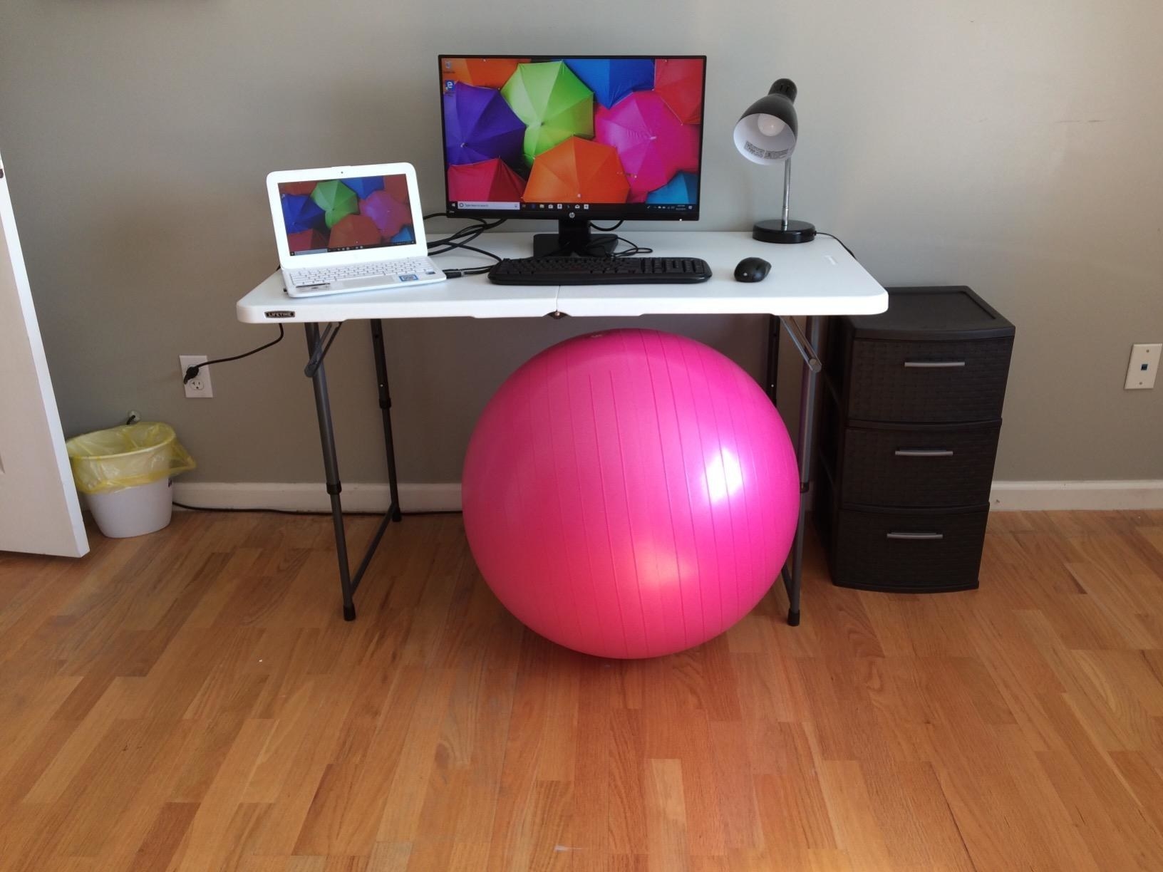 the ball in pink at a work station