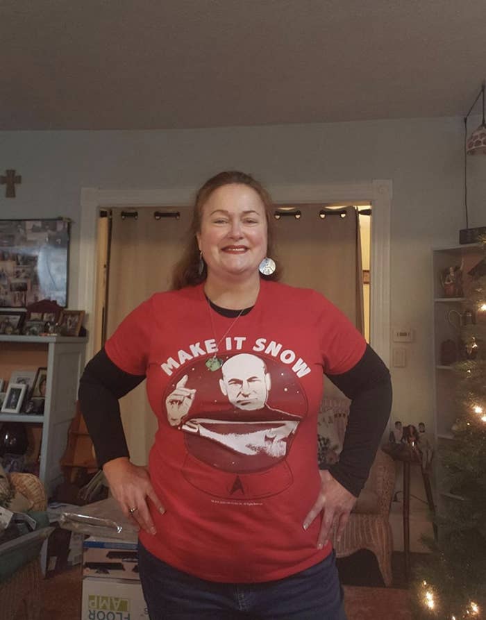 Reviewer wearing a red T-shirt with Captain Picard on it and the words &quot;make it snow&quot;