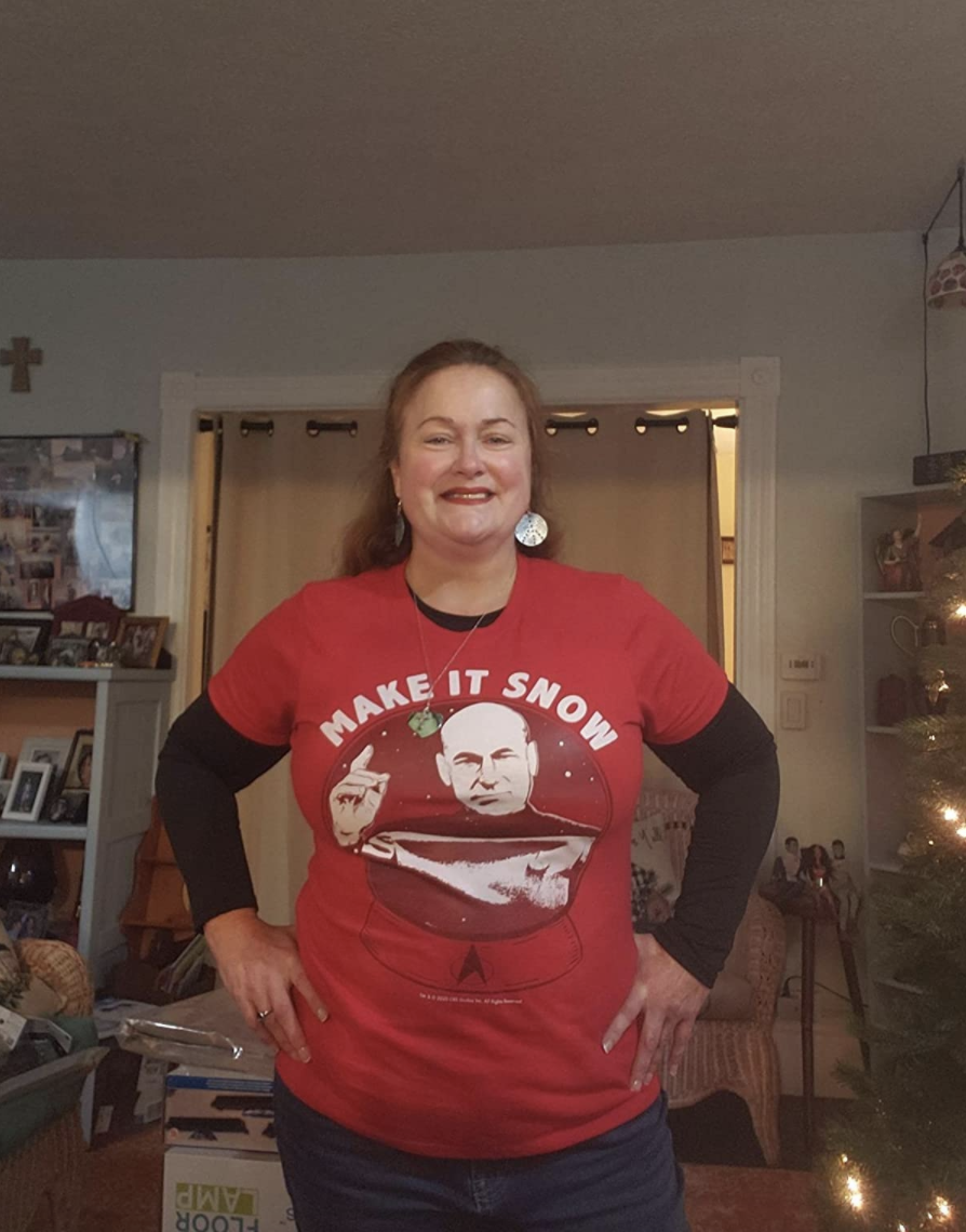 Reviewer wearing a red T-shirt with Captain Picard on it and the words &quot;make it snow&quot;