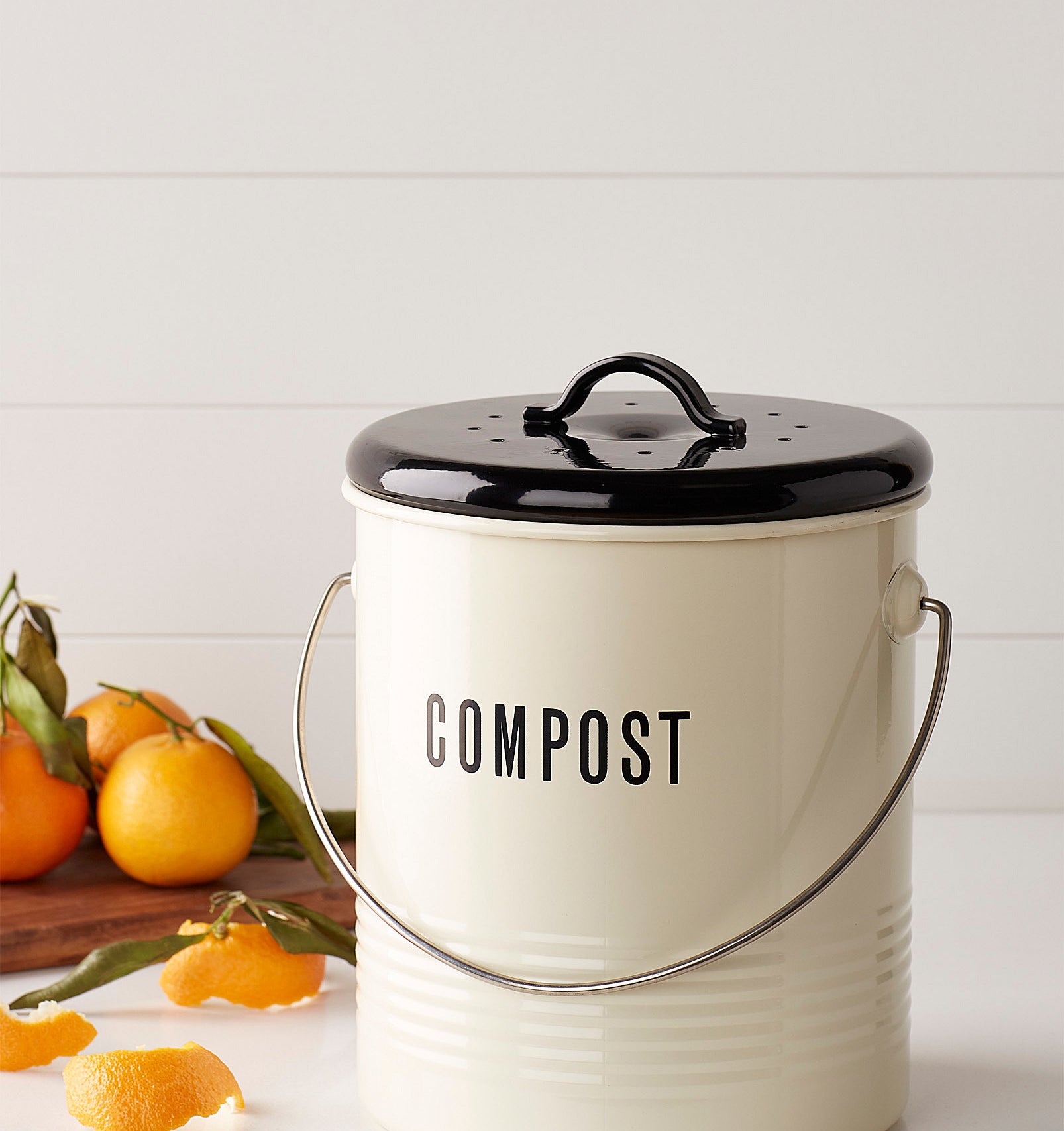 A cute compost bin that says &quot;compost&quot; on it