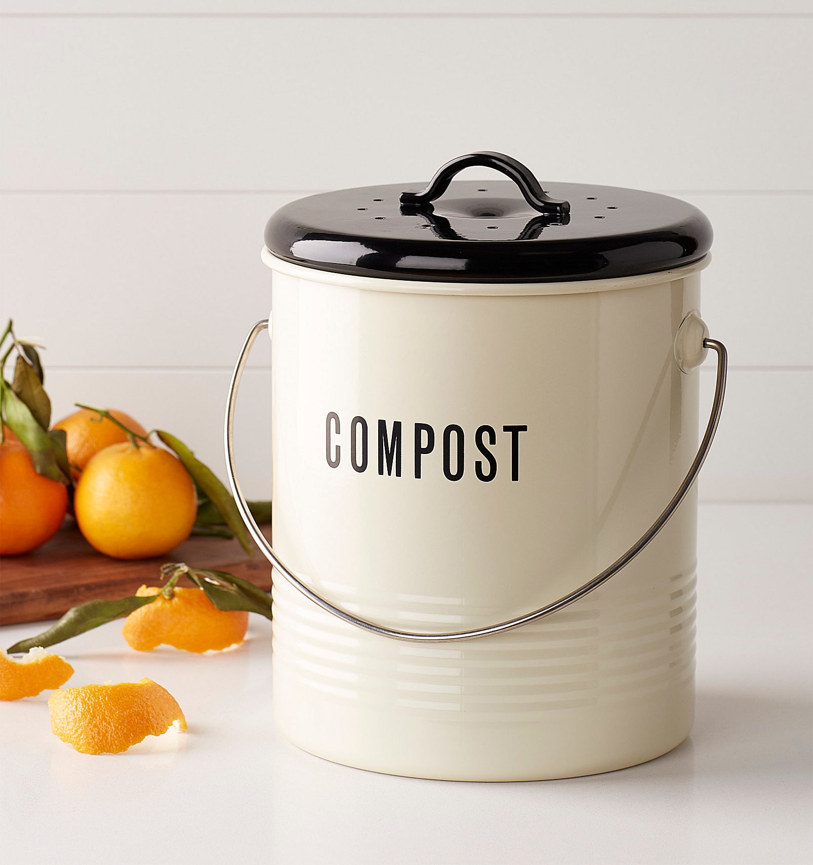 A cute compost bin that says "compost" on it