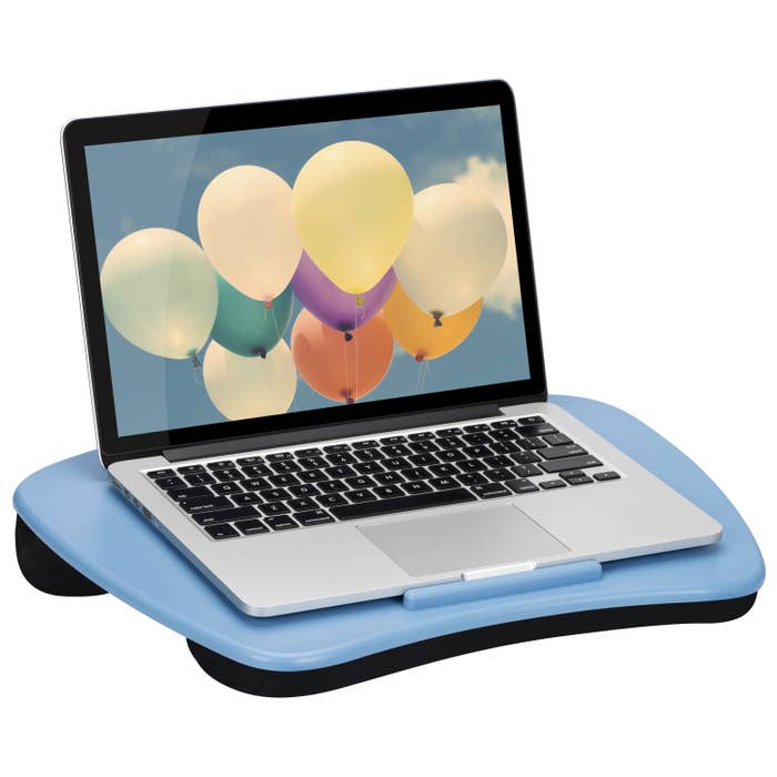 the lap desk in blue with a computer on it