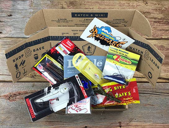 the mystery tackle box opened showing the different baits, lures and tackles