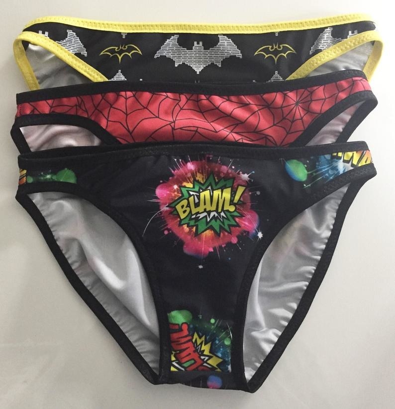 a three-pack of super-hero themed underwear, including a batman and spiderman themed pair