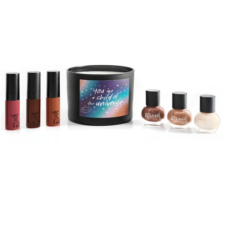 the holiday collection with three lip colors, the candle, and three nail polishes 