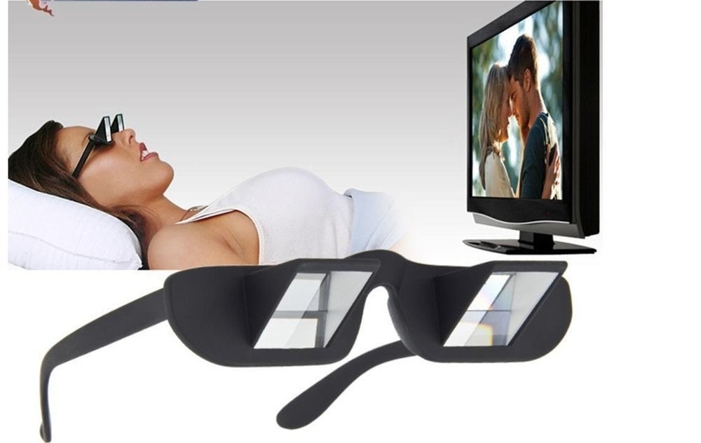 A woman watching TV using the glasses.