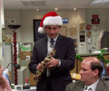 A GIF of Michael Scott from The Office unwrapping a gift.