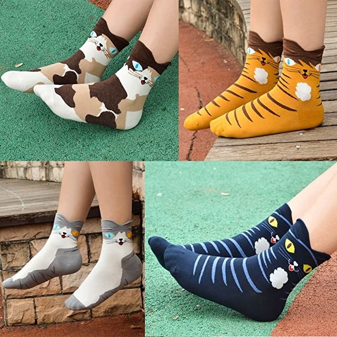 Four different pairs of cat-themed crew socks
