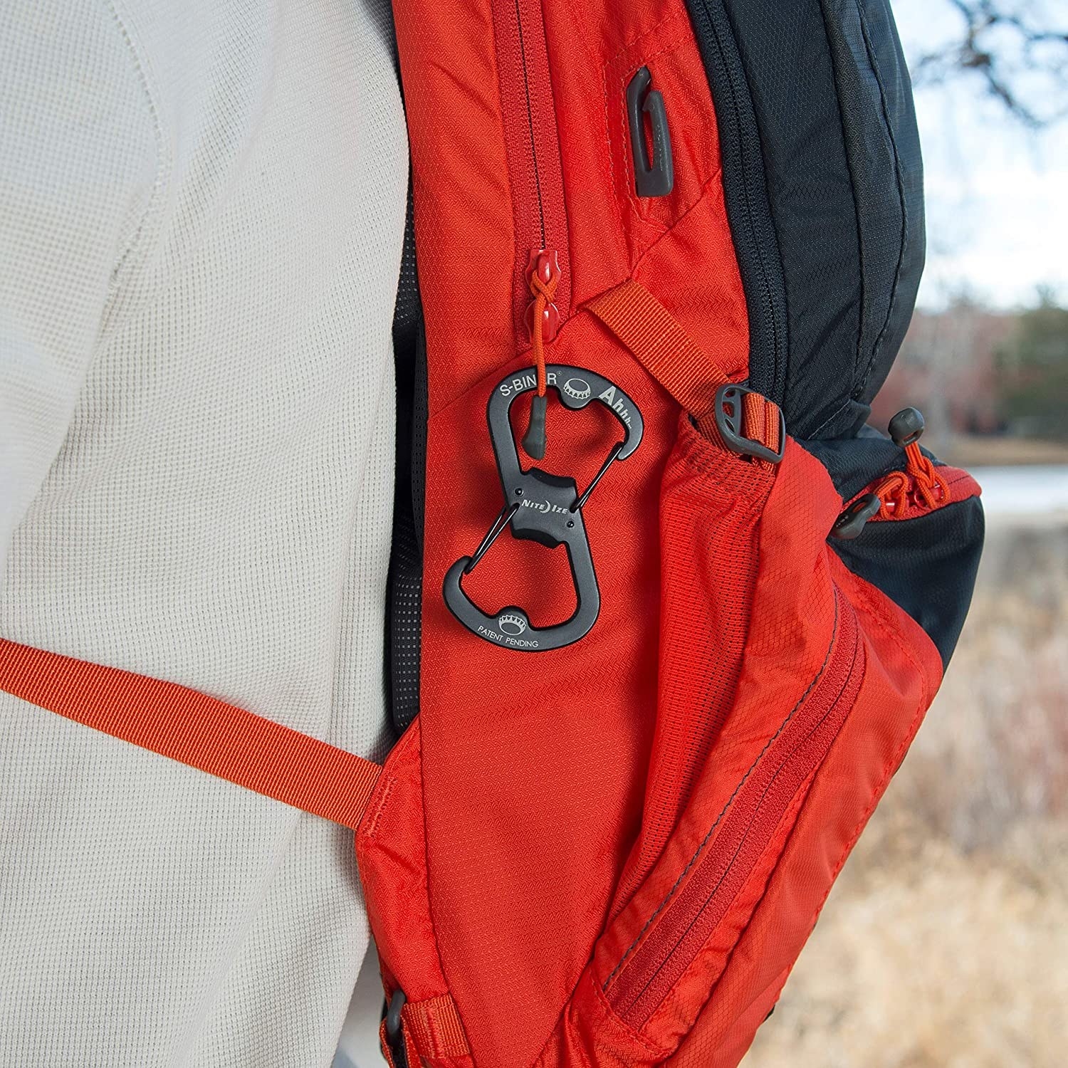 The carabiner attached to a backpack