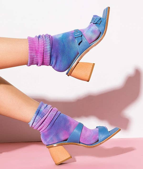 model wearing purple/pink tie-dye socks with heeled sandals