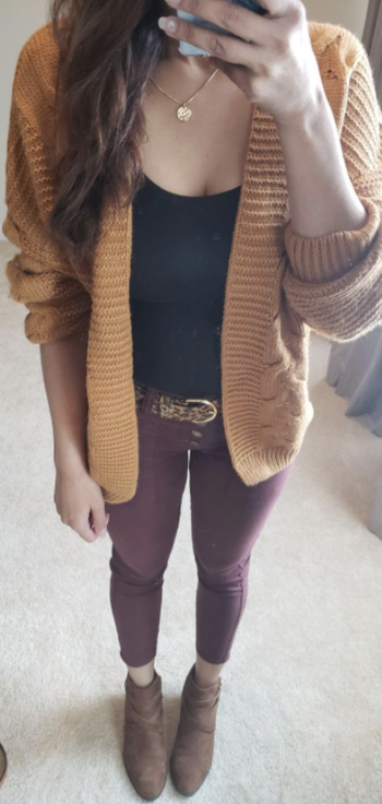 Daily News | Online News Reviewer wearing mustard cardigan